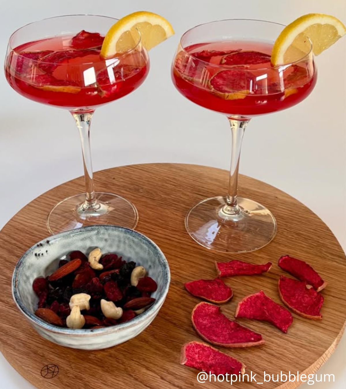 RCR Aria Champagne Coupe 33 cl (6 pcs) with a red drink and orange garnish